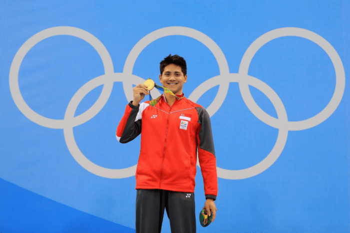 Joseph Schooling shows his gold medal