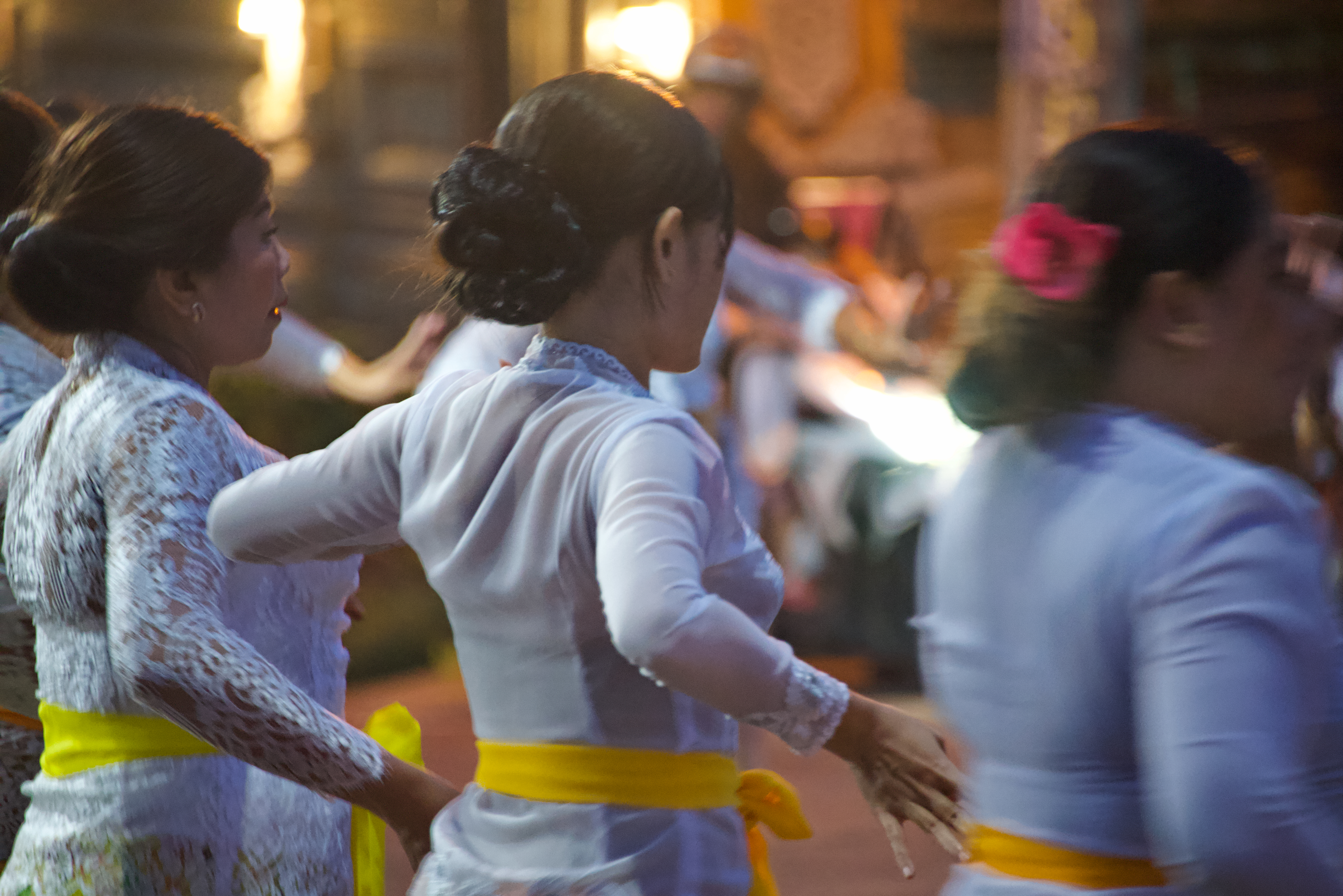 Women from a village near Ubud dance during a temple ceremony